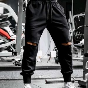 Black sweats with ripped knees